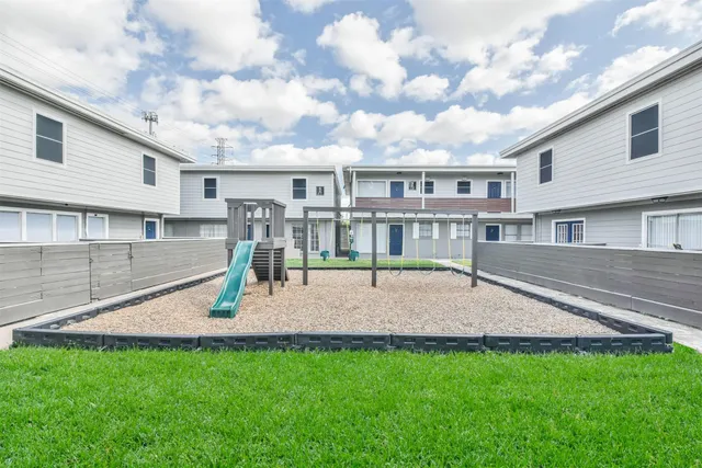 a swimming pool with outdoor seating and yard