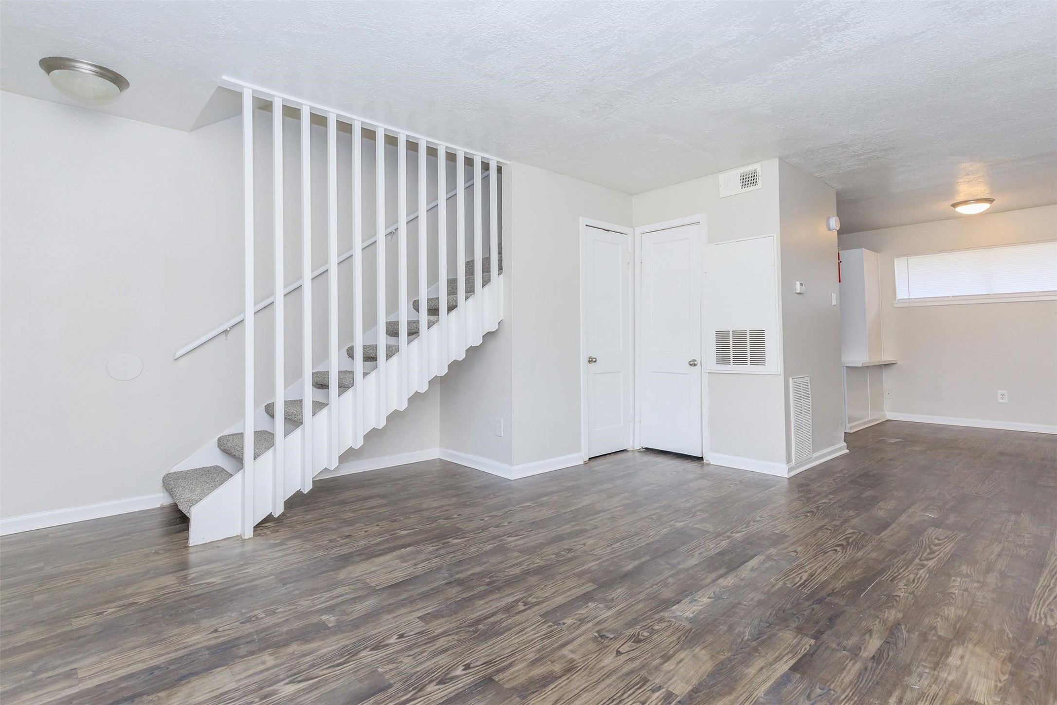 8271 Stone Street, Unit 7107 Houston, TX 77061 - Photo 4 of 28 a view of entryway with wooden floor