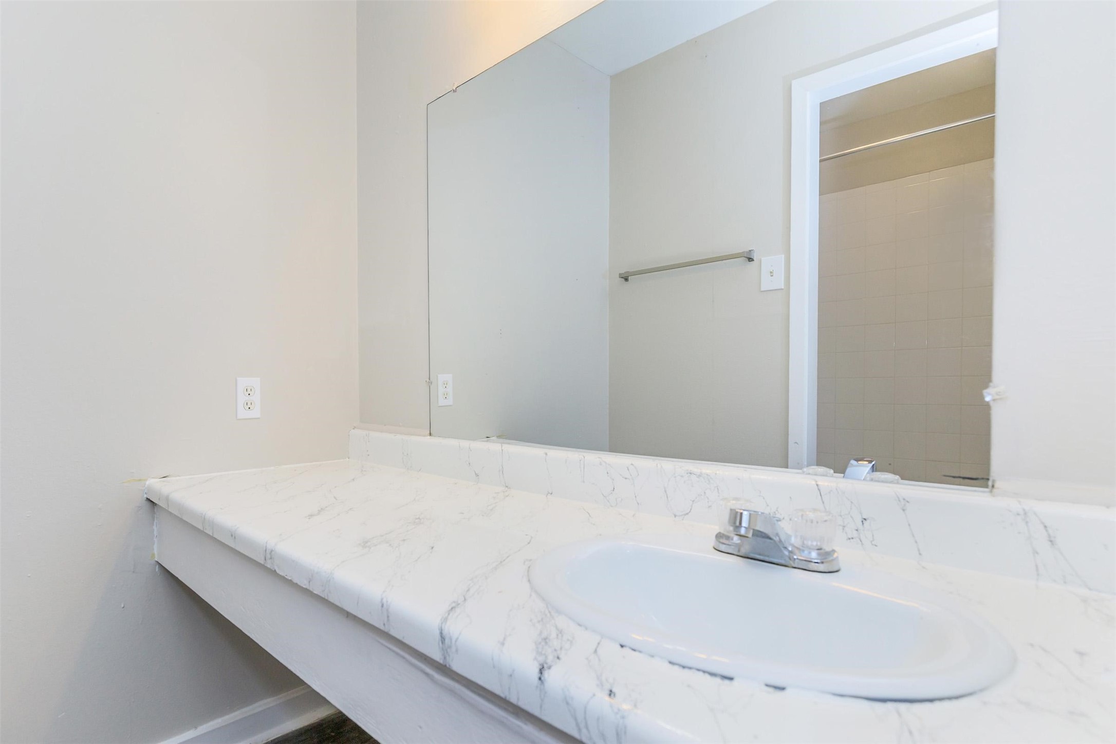 8271 Stone Street, Unit 7107 Houston, TX 77061 - Photo 10 of 28 a bathroom with a sink and a mirror