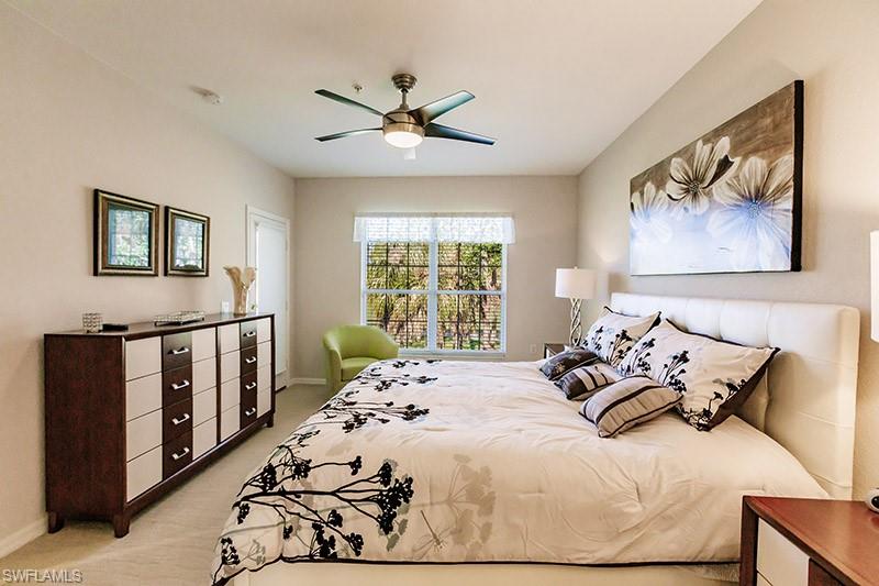 8135 Celeste Drive, Unit 4218 Naples, FL 34113 - Photo 23 of 37 Carpeted bedroom featuring ceiling fan