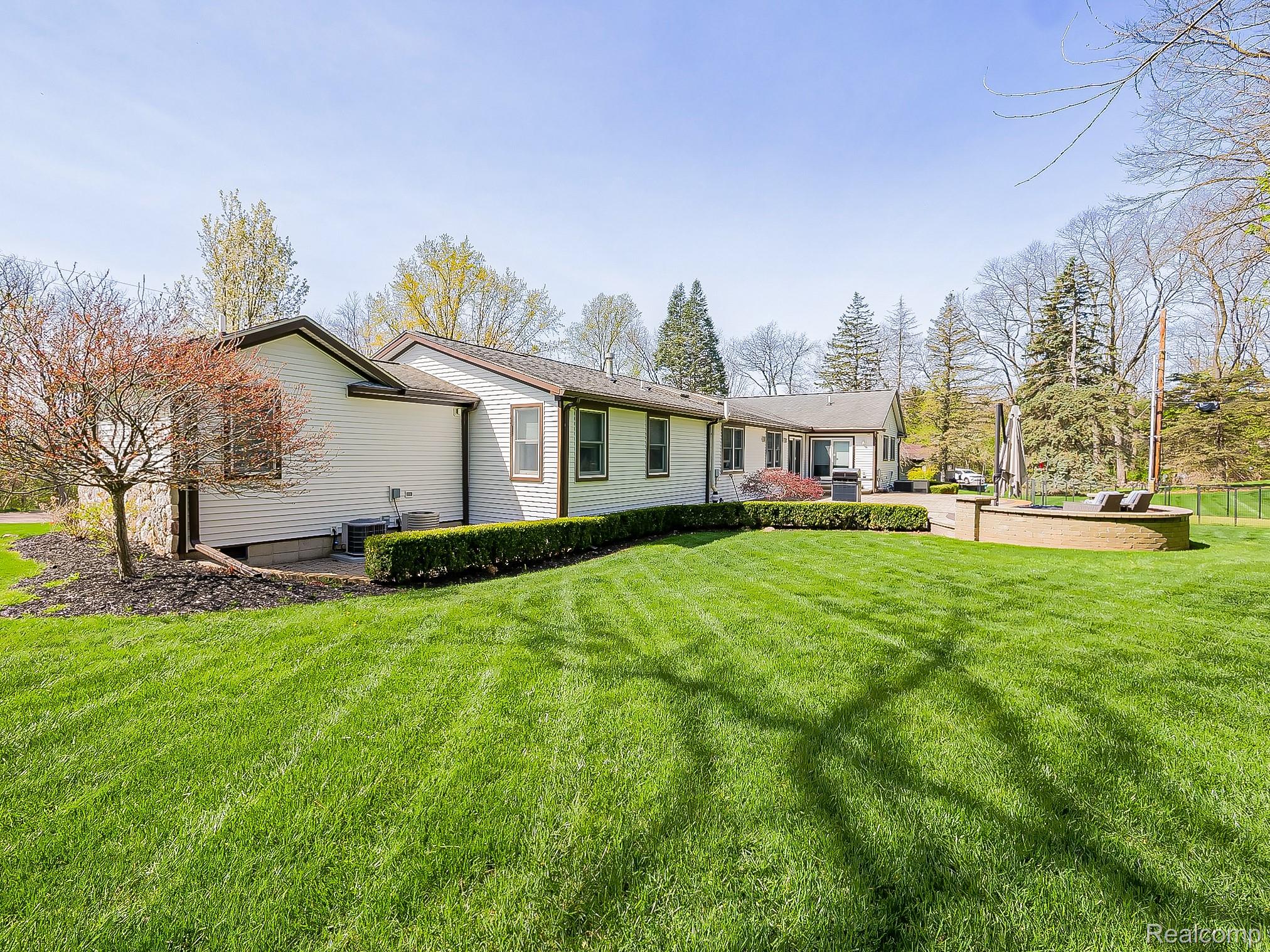 3720 East Clarkston Road Oakland, MI 48363 - Photo 48 of 60 View of front of house featuring a front lawn