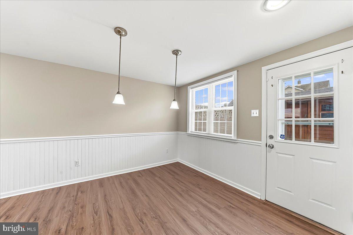 159 Chadwick Avenue Linwood, PA 19061 - Photo 13 of 35 a view of an empty room with wooden floor and a window