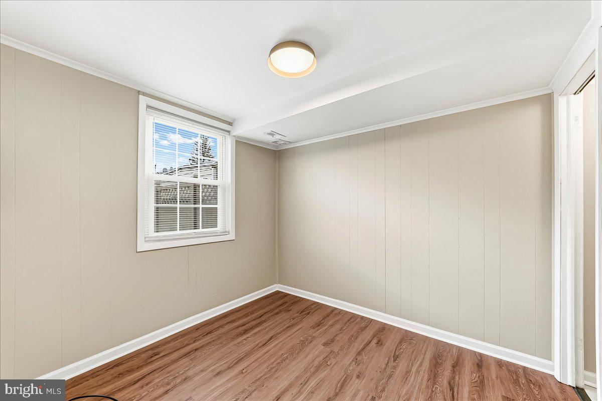 159 Chadwick Avenue Linwood, PA 19061 - Photo 15 of 35 an empty room with wooden floor and windows