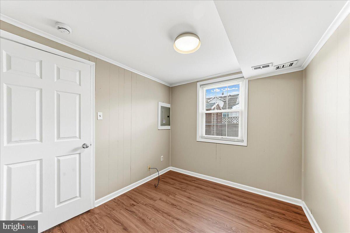 159 Chadwick Avenue Linwood, PA 19061 - Photo 17 of 35 an empty room with wooden floor and windows