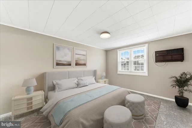 a bedroom with a bed and a potted plant