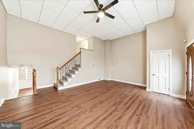 a view of an entryway with wooden floor