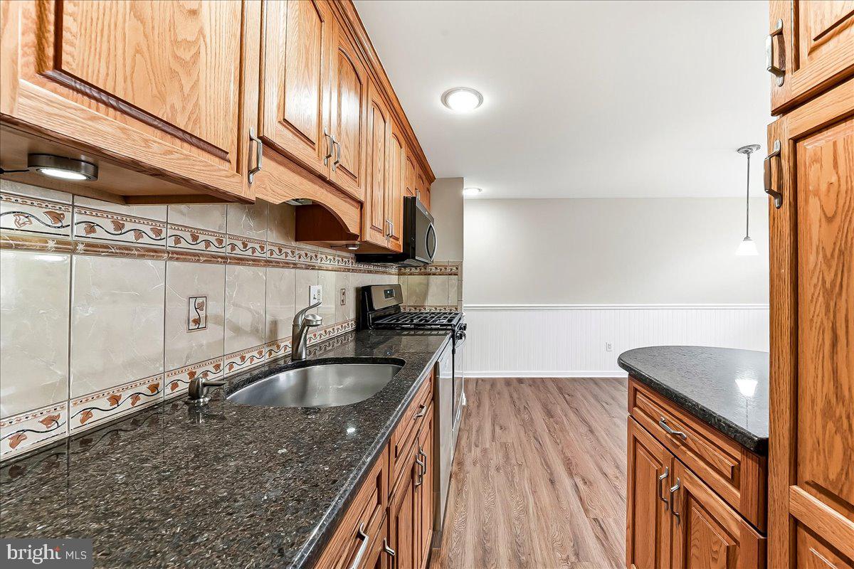 159 Chadwick Avenue Linwood, PA 19061 - Photo 10 of 35 a kitchen with a sink a counter top space and cabinets