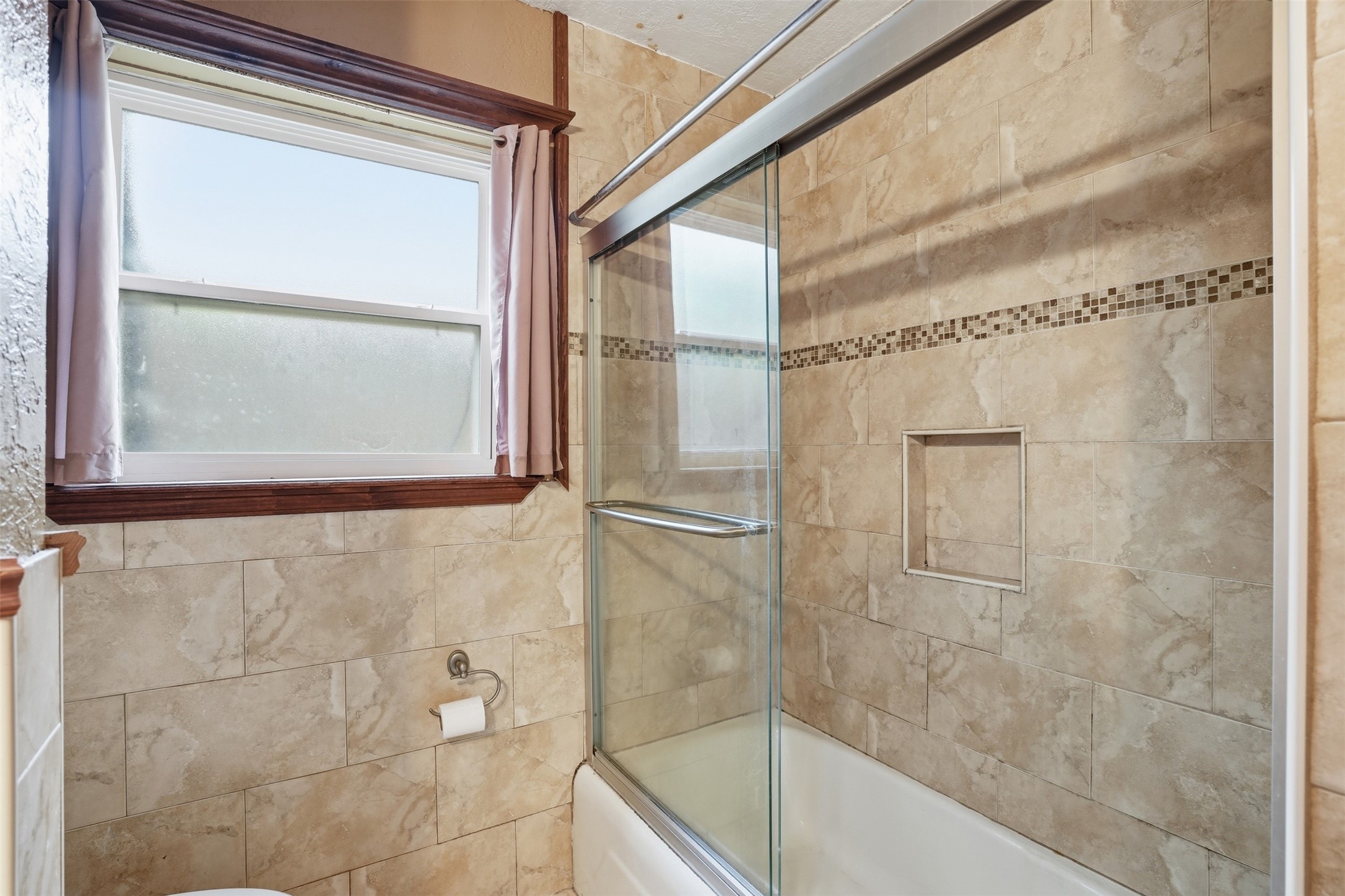 2605 Burke Road Pasadena, TX 77502 - Photo 23 of 29 a bathroom with a glass shower door
