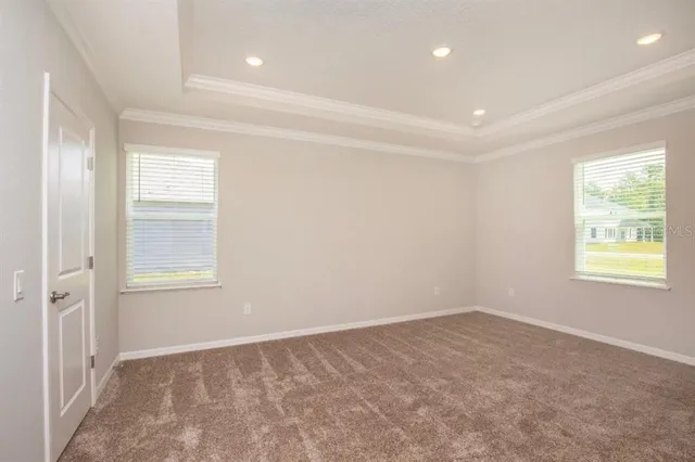 a bathroom with a granite countertop sink mirror and toilet