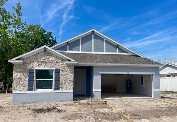 a front view of a house with a garage