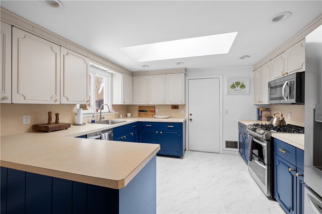 127 Dellwood Road Cranston, RI 02920 - Photo 14 of 47 skylight in kitchen invites the light to pour in