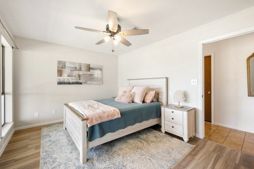 3410 West Ranch Road 152 Llano, TX 78643 - Photo 18 of 36 Bedroom featuring a ceiling fan and light wood-style floors