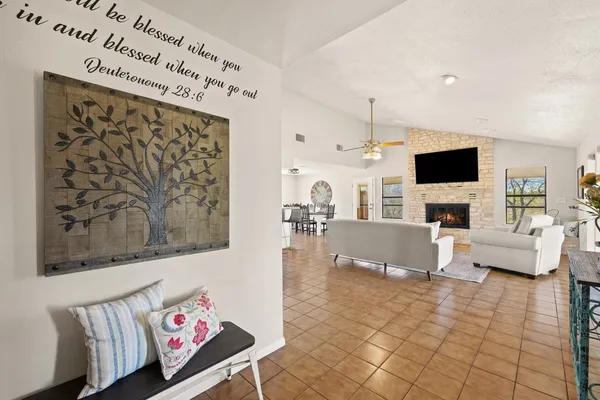 a living room with furniture fireplace and a flat screen tv
