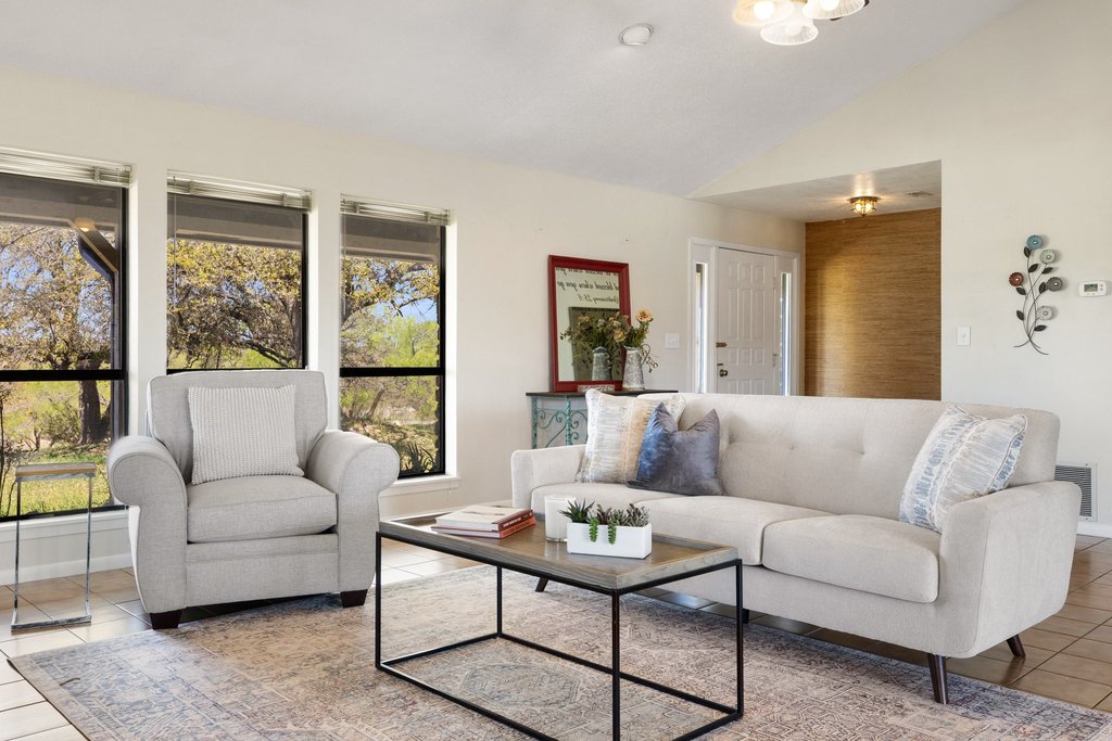 3410 West Ranch Road 152 Llano, TX 78643 - Photo 6 of 36 Tiled living room with vaulted ceiling and baseboards