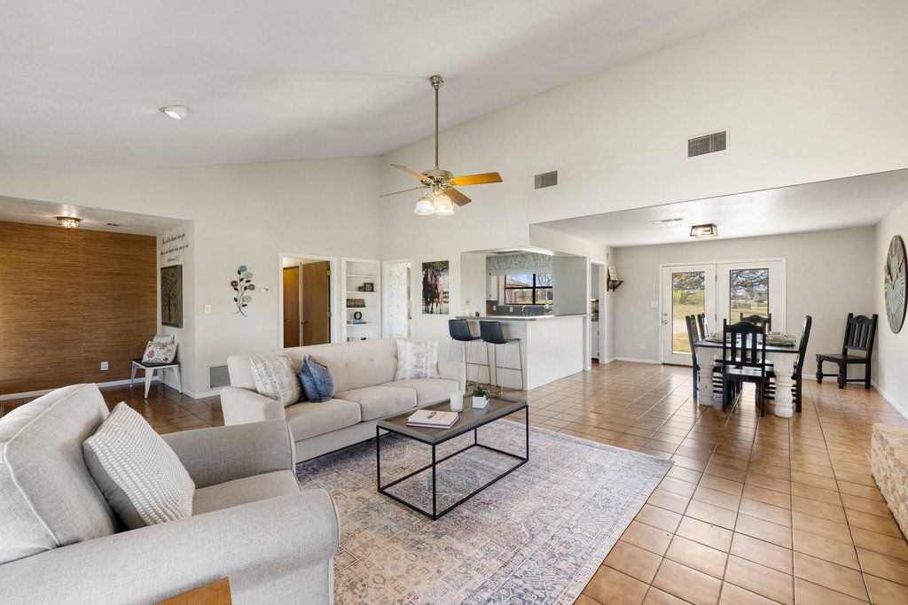 3410 West Ranch Road 152 Llano, TX 78643 - Photo 9 of 36 Tiled living area featuring ceiling fan and lofted ceiling