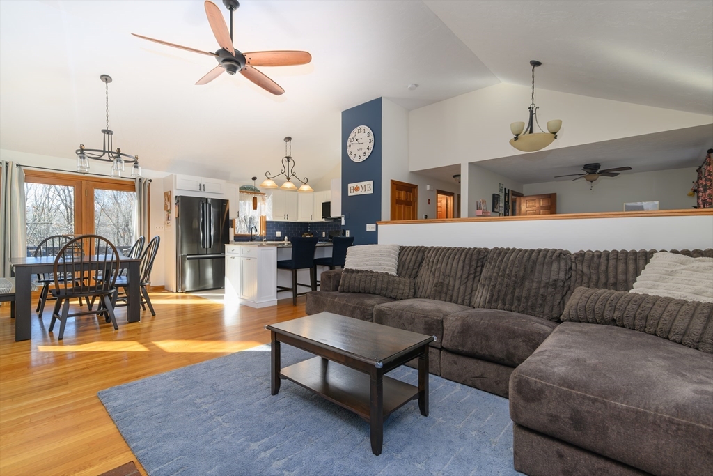 12 Hickory Road Millville, MA 01529 - Photo 14 of 41 a living room with furniture and a chandelier