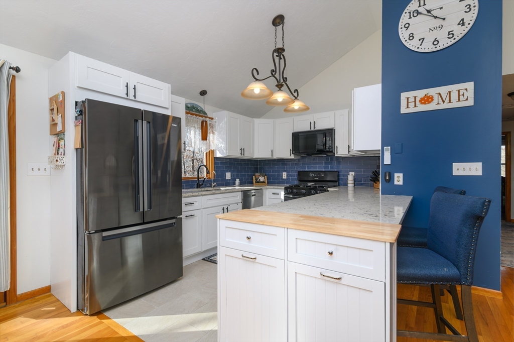12 Hickory Road Millville, MA 01529 - Photo 16 of 41 a kitchen with stainless steel appliances a refrigerator sink and microwave