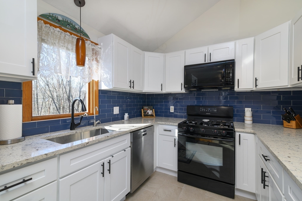 12 Hickory Road Millville, MA 01529 - Photo 18 of 41 a kitchen with stainless steel appliances granite countertop grey cabinets a stove a sink and dishwasher