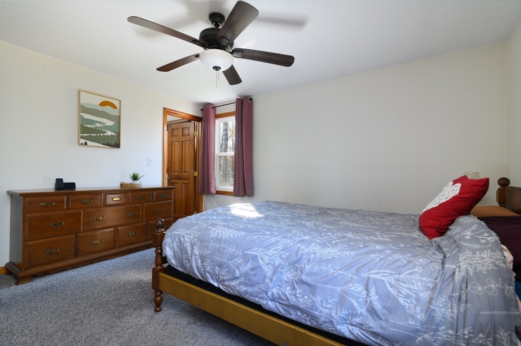 12 Hickory Road Millville, MA 01529 - Photo 21 of 41 a bed room with a bed and a dresser