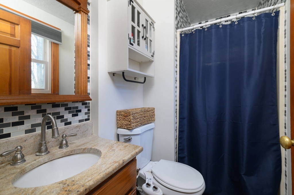12 Hickory Road Millville, MA 01529 - Photo 22 of 41 a bathroom with a granite countertop sink vanity mirror and toilet