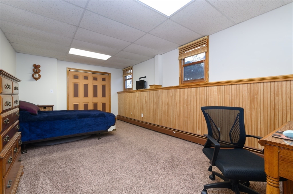 12 Hickory Road Millville, MA 01529 - Photo 26 of 41 a bed room with furniture and a window