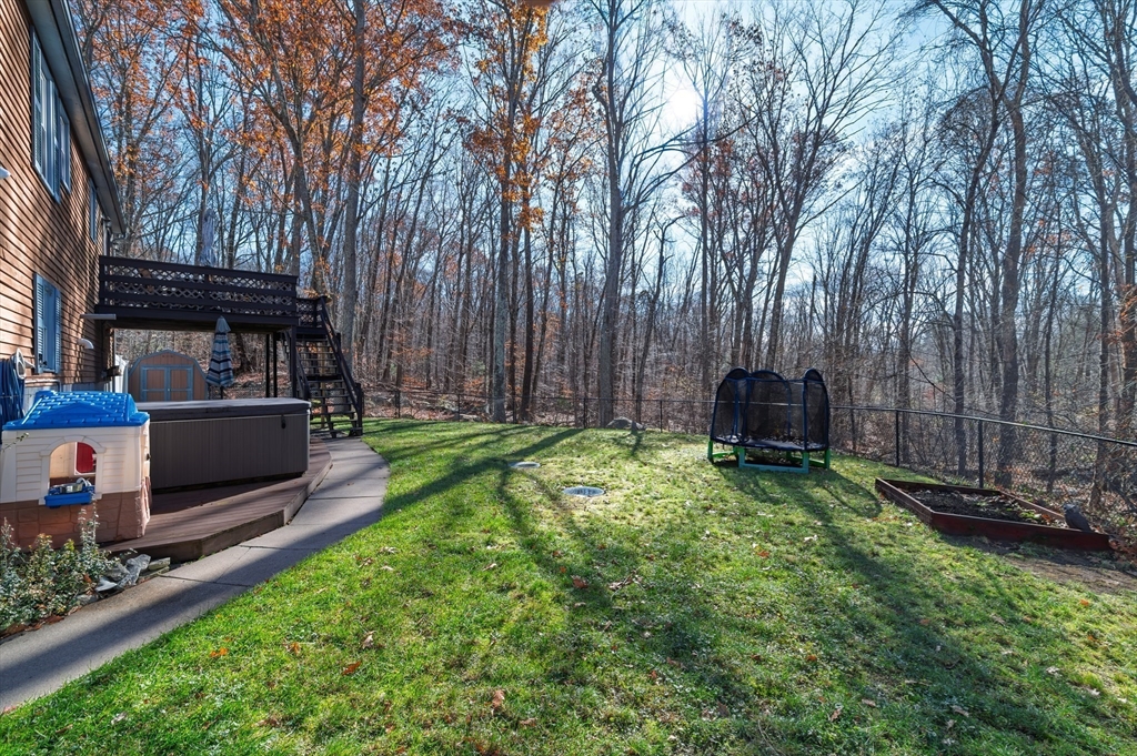 12 Hickory Road Millville, MA 01529 - Photo 39 of 41 a view of backyard with seating space and wooden fence