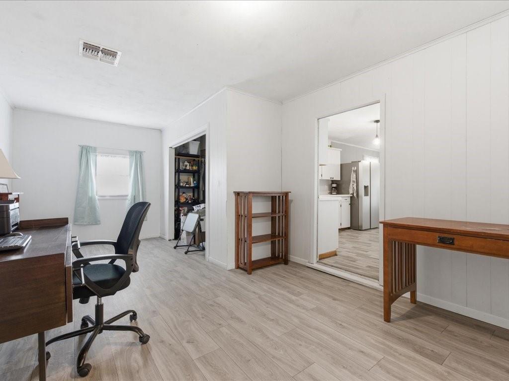 1085 Duke Road Kennard, TX 75847 - Photo 17 of 40 Open-concept interior featuring light wood-finish flooring, white wall paneling, and recessed lighting