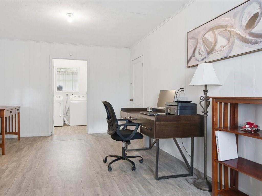 1085 Duke Road Kennard, TX 75847 - Photo 18 of 40 Spacious room featuring light wood-finish flooring, white panel walls, and a recessed ceiling light