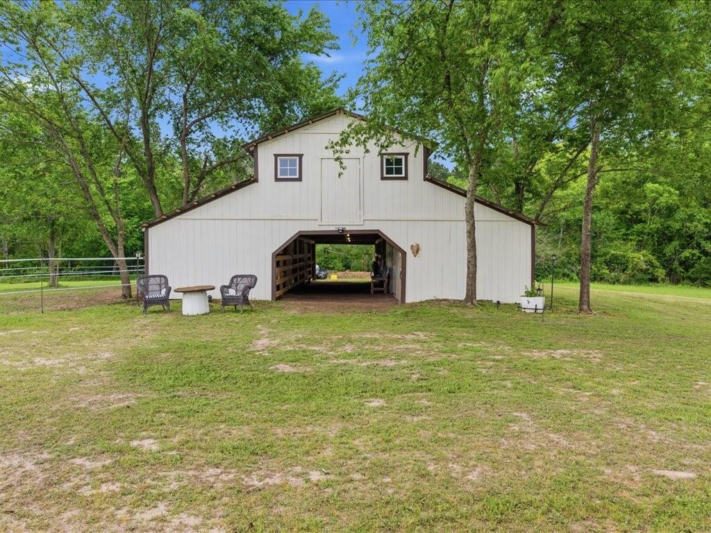 1085 Duke Road Kennard, TX 75847 - Photo 27 of 40 Barn structure featuring white board siding and dark trim accents