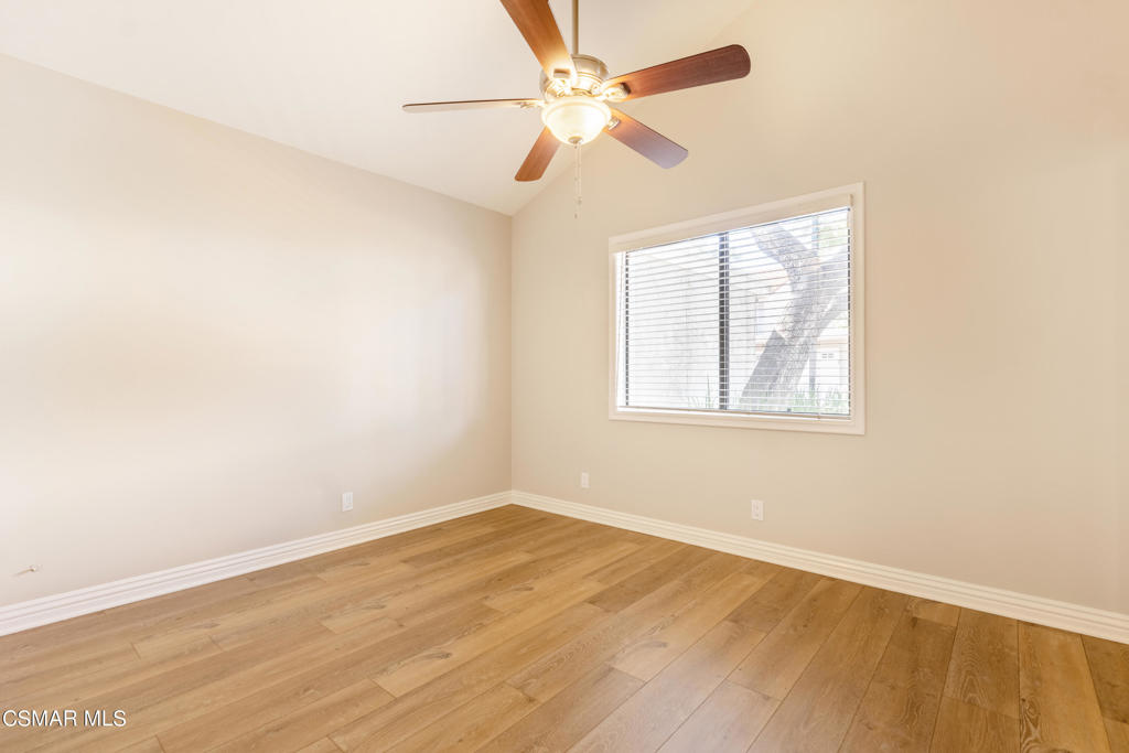 932 Thistlegate Road Oak Park, CA 91377 - Photo 19 of 25 an empty room with a window and a ceiling fan