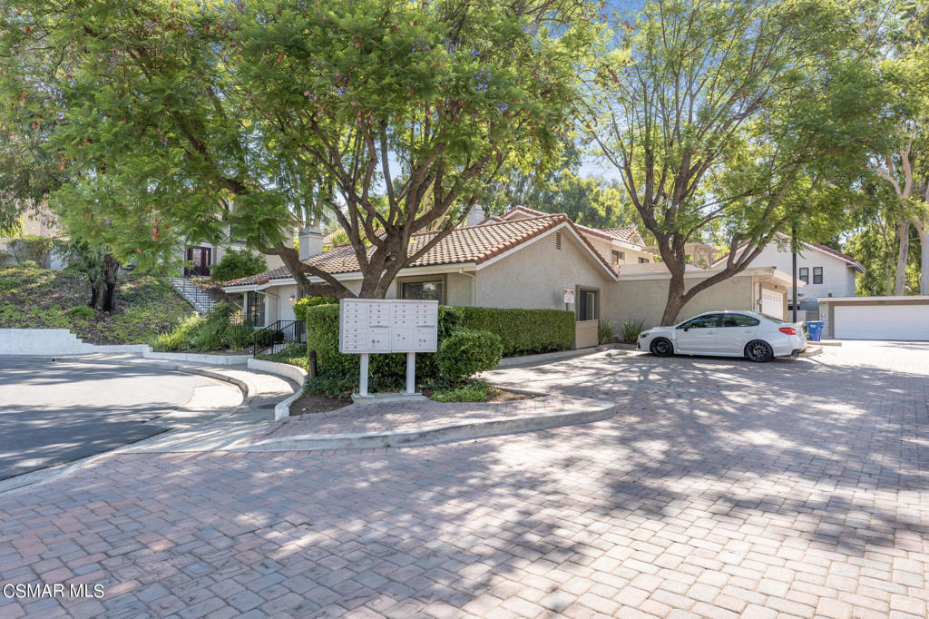 932 Thistlegate Road Oak Park, CA 91377 - Photo 25 of 25 a view of a house with a yard and sitting area