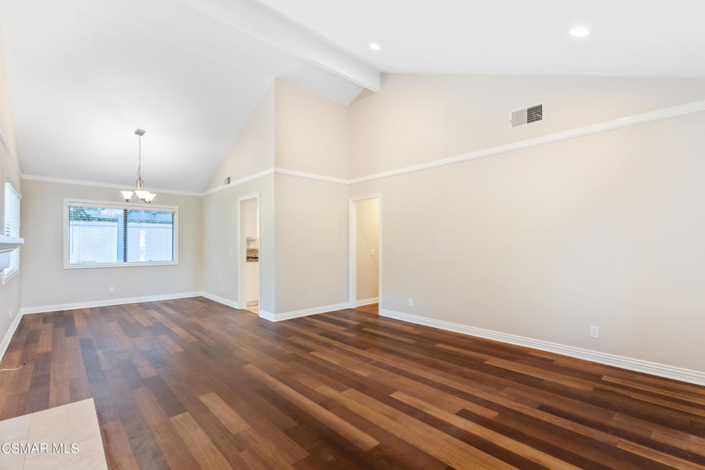 932 Thistlegate Road Oak Park, CA 91377 - Photo 4 of 25 an empty room with wooden floor and windows