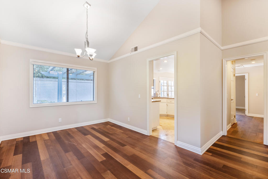 932 Thistlegate Road Oak Park, CA 91377 - Photo 7 of 25 a view of an empty room with wooden floor and a window