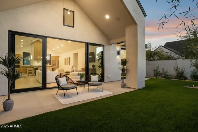 a view of a backyard with sitting area