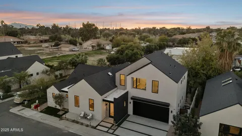 a building outdoor space with patio furniture and garden