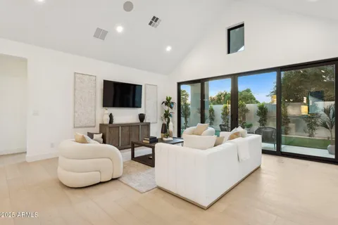 a view of hallway with window and furniture