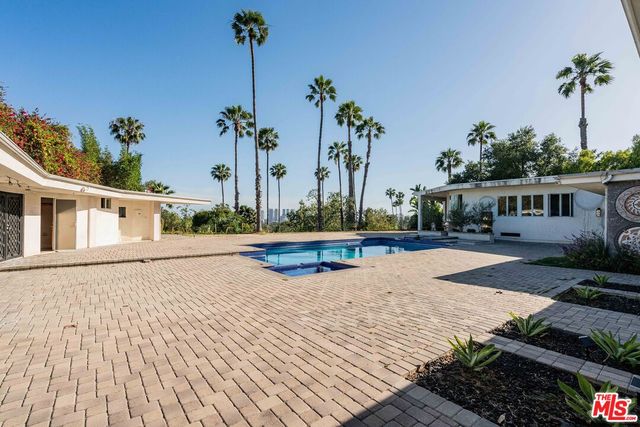 a view of a city from a corridor