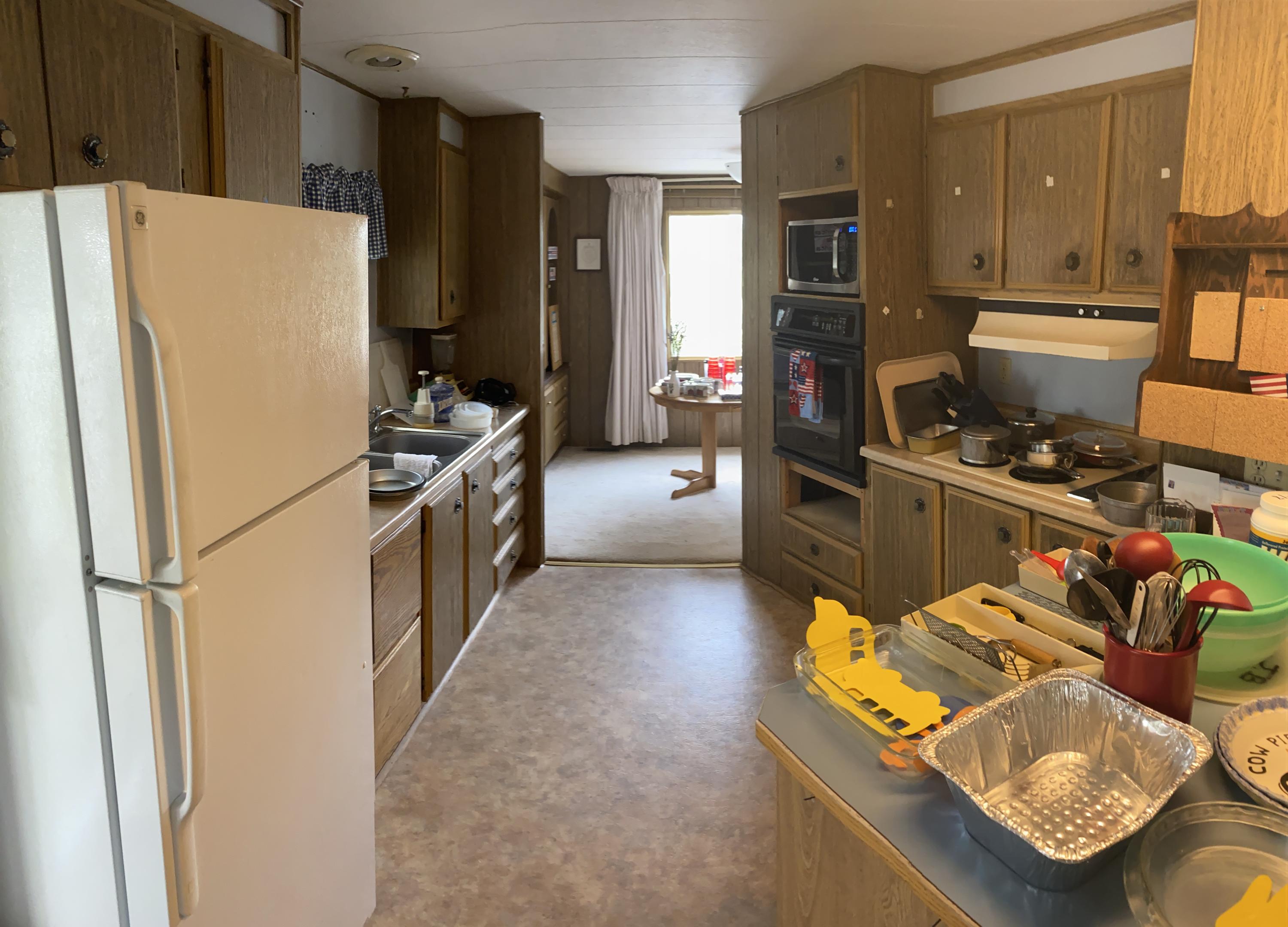 19553 Apache Road Bend, OR 97702 - Photo 12 of 18 a kitchen with stainless steel appliances granite countertop a refrigerator stove and sink