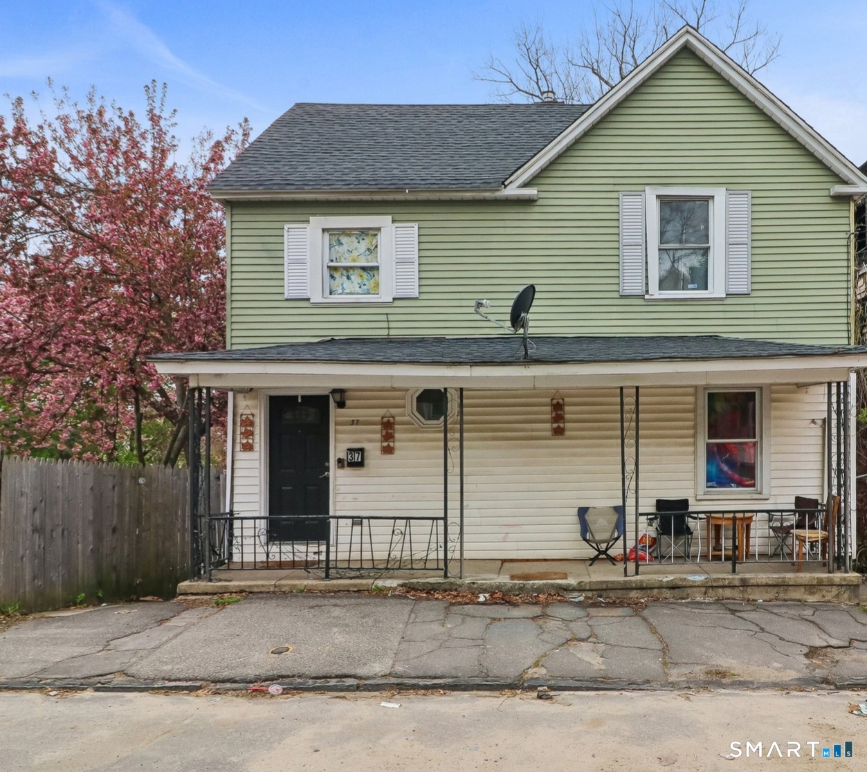 37 Manhan Street Waterbury, CT 06710 - Photo 5 of 19 a front view of a house with a yard and garage