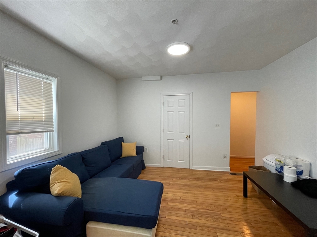 48 Derby Street, Unit 1 Somerville, MA 02145 - Photo 2 of 10 a living room with furniture and a window