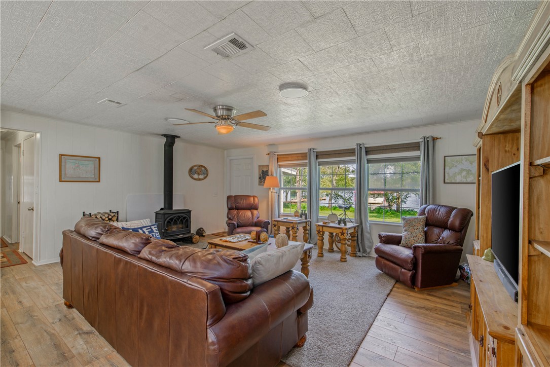 11001 Clyde Acord Road Franklin, TX 77856 - Photo 11 of 43 a living room with furniture and a flat screen tv