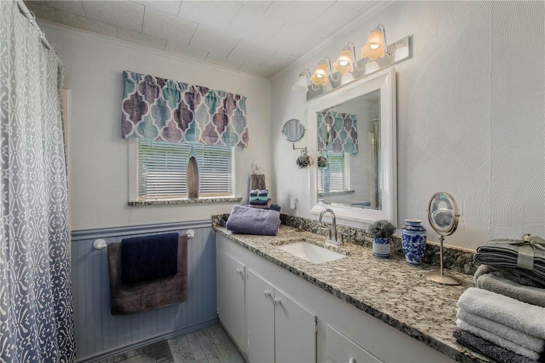 11001 Clyde Acord Road Franklin, TX 77856 - Photo 17 of 43 a bathroom with a sink double vanity and a mirror