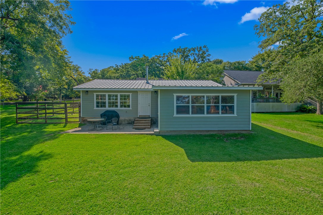 11001 Clyde Acord Road Franklin, TX 77856 - Photo 23 of 43 a view of a house with a yard table and chairs