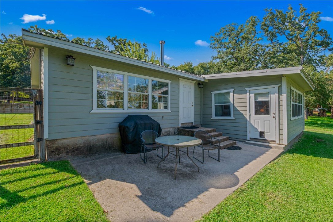 11001 Clyde Acord Road Franklin, TX 77856 - Photo 24 of 43 a view of a house with backyard sitting area and garden
