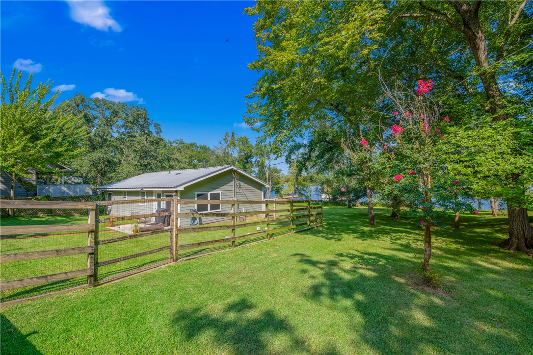11001 Clyde Acord Road Franklin, TX 77856 - Photo 26 of 43 a view of a garden with a house in the background