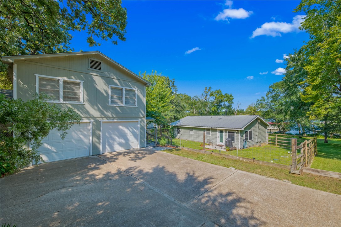 11001 Clyde Acord Road Franklin, TX 77856 - Photo 3 of 43 a front view of a house with a yard
