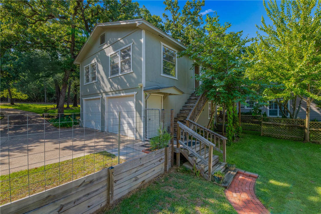 11001 Clyde Acord Road Franklin, TX 77856 - Photo 5 of 43 a view of house with a yard and potted plants