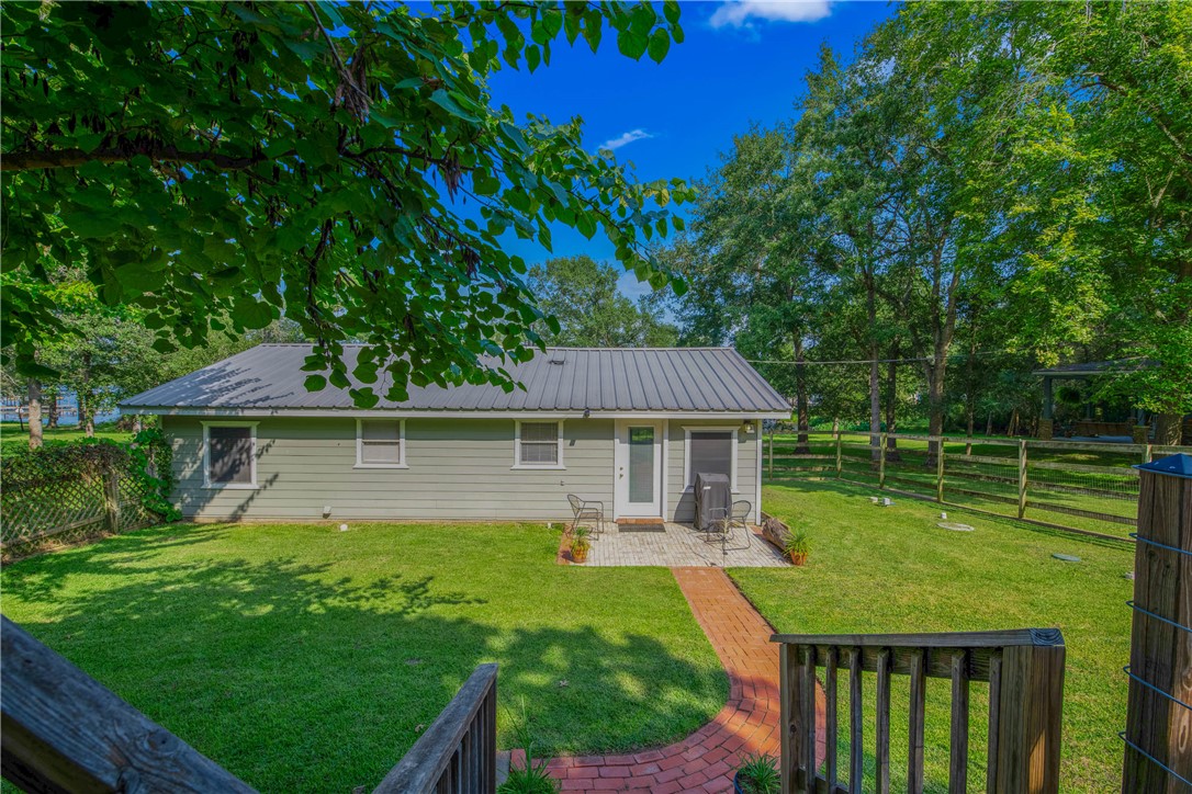 11001 Clyde Acord Road Franklin, TX 77856 - Photo 6 of 43 a front view of a house with a yard table and chairs