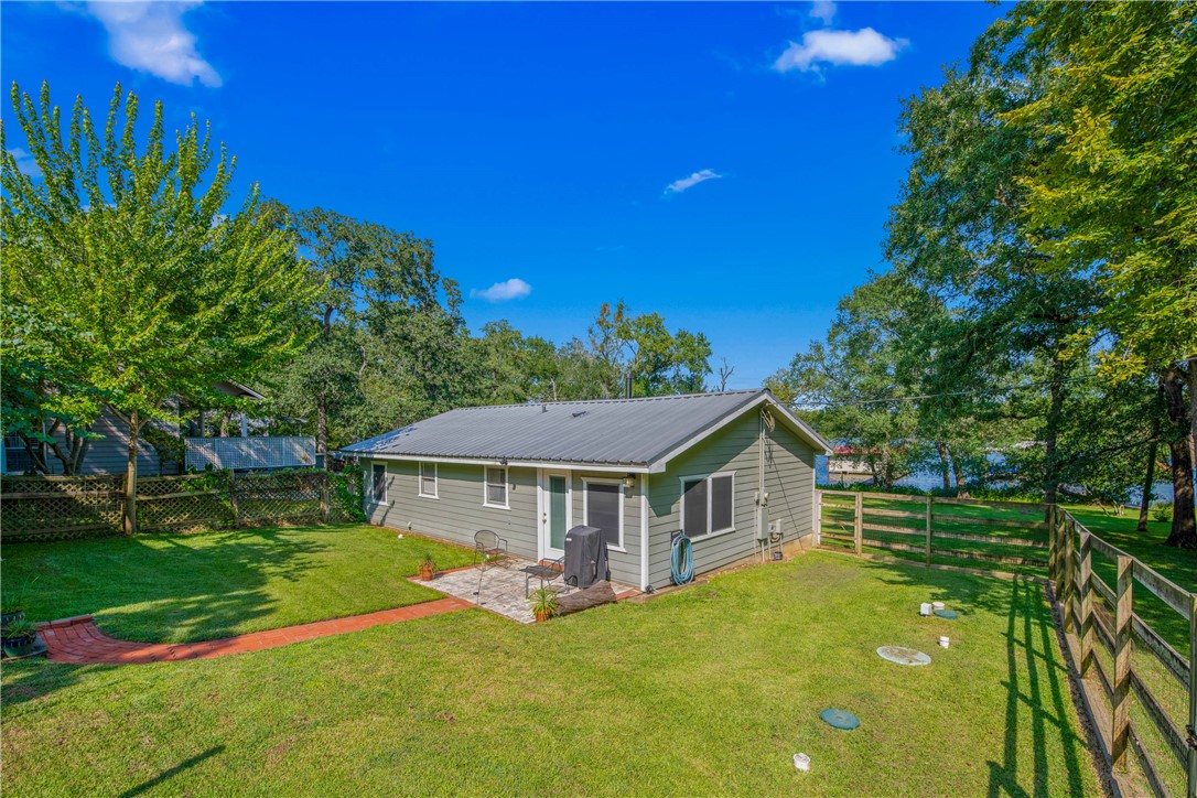 11001 Clyde Acord Road Franklin, TX 77856 - Photo 8 of 43 a front view of a house with a garden