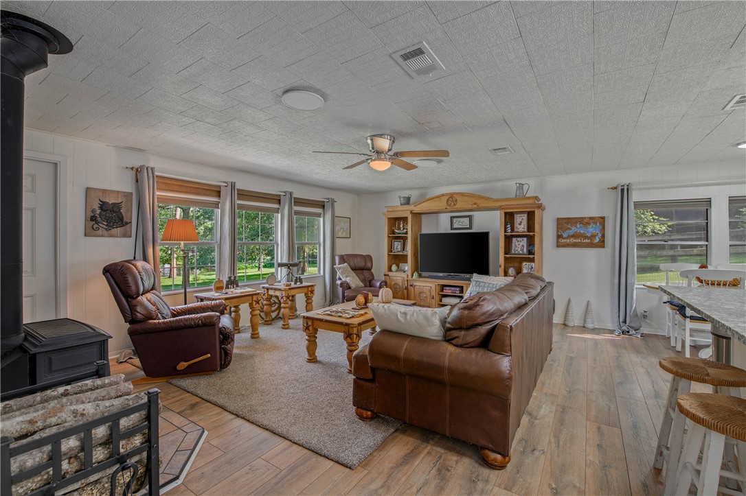 11001 Clyde Acord Road Franklin, TX 77856 - Photo 10 of 43 a living room with furniture and a fireplace